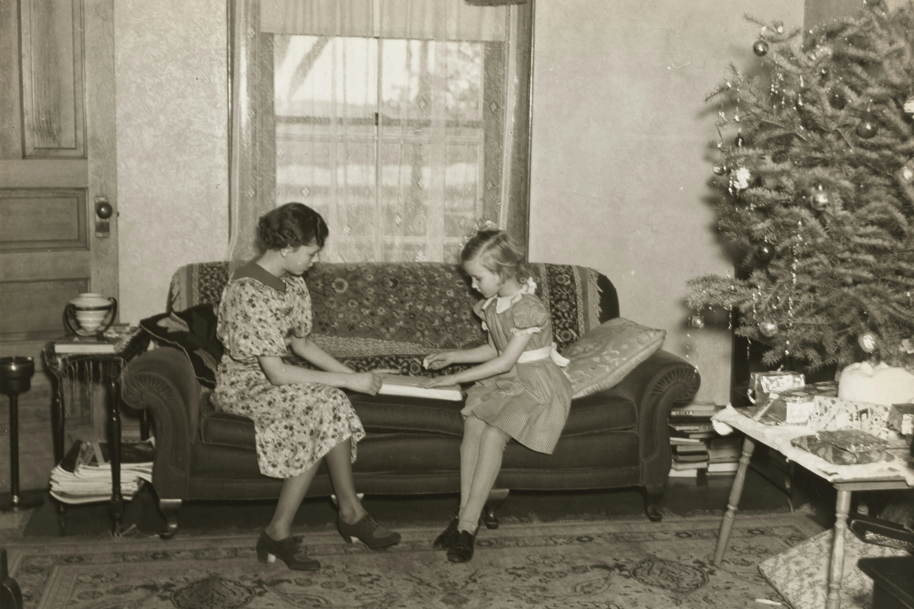 Vampire twin sisters with heart-shaped fangs